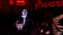 Scary Nun Eating Popcorn GIF - Scary Nun Eating Popcorn Snacking GIFs