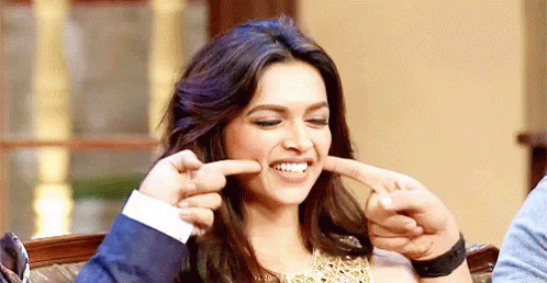 Those Dimples :) GIF - Deepikapadukone Pointing To Dimples Indian Girl Smiling GIFs