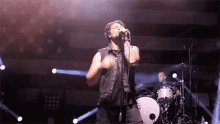 Front Man Vocalist GIF - Front Man Vocalist Rocking The Stage GIFs