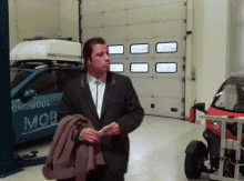 Travolta Garage GIF - Travolta Garage Cars GIFs