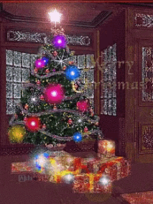 Merry Christmas Lights Blinking GIF - Merry Christmas Lights Blinking Presents Under Tree GIFs