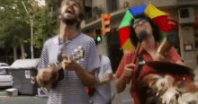 Playing On The Street Band GIF - Playing On The Street Band Playing Guitar While Walking GIFs