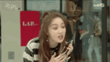 Lee Sung Kyung GIF - Lee Sung Kyung Red Lips Check The Phone GIFs