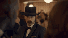 Removes Hat At Party Bring Wynonna Home GIF - Removes Hat At Party Bring Wynonna Home Doc Holliday GIFs