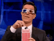 Stephen Colbert Eating GIF - Stephen Colbert Eating Popcorn GIFs