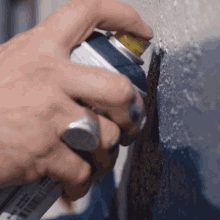 Spraying On A Wall Glossblack GIF - Spraying On A Wall Glossblack Red Bull GIFs