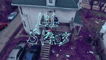 house top view neon color drone shot lil skies