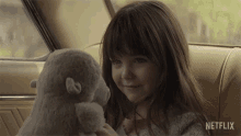 Playing With Stuffed Toy Guillermina Sorribes Liotta GIF - Playing With Stuffed Toy Guillermina Sorribes Liotta Nina GIFs