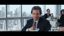 The Wolf Of Wall Street Dances To The Beat Of Mcconaughey'S Drum. GIF - Movies Wolfofwallstreet GIFs