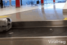 Luggage Wrapped Tight GIF - Luggage Wrapped Tight Conveyor Belt GIFs