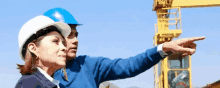 man pointing construction hard hat