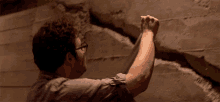 Sticking Duct Tape To A Huge Wall Crack Seth Rogen GIF - Sticking Duct Tape To A Huge Wall Crack Seth Rogen This Is The End GIFs