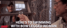 Heres To Swimming With Bow Legged Woman Toast GIF - Heres To Swimming With Bow Legged Woman Toast Cheers GIFs