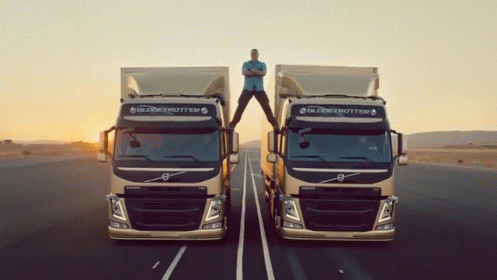 Jean-claude Van Damme Does Epic Splits Between Two Trucks GIF - Jean Claude Van Damme Splits Flexibility - Discover & Share GIFs