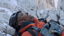 hyped anthony mackie descends a cliff face excited triumphant victory