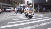 Crossing The Street Pedestrians GIF - Crossing The Street Pedestrians In Costumes GIFs