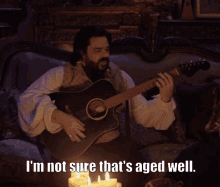 not aged well what we do in the shadows laszlo matt berry playing guitar