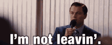 The Wolf Of Wall Street Im Still Here GIF - The Wolf Of Wall Street Im Still Here Im Not Leaving GIFs