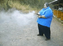 fat guy shooting gun gun shot