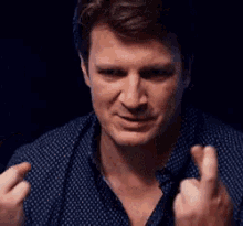 Nathan Fillion Fingers Crossed GIF - Nathan Fillion Fingers Crossed GIFs