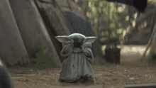baby yoda the mandalorian sips baby yoda the mandalorian sips