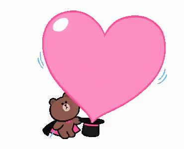 Pohybující se kreslený medvěd v kouzelnickém plášti s cylindrem, ze kterého vychází růžové srdce.