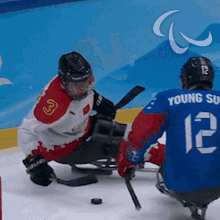 Bump Into Each Other Para Ice Hockey GIF - Bump Into Each Other Para Ice Hockey Young Sung Kim GIFs