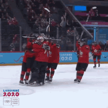 Hugging Team Canada GIF - Hugging Team Canada Embrace GIFs