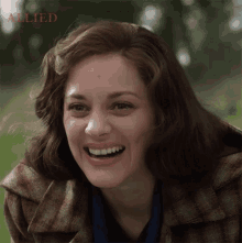 happy marion cotillard marianne beausejour allied smiling