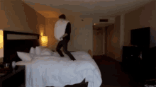 Pillow Fight GIF - Pillowfight Hotel Jump GIFs