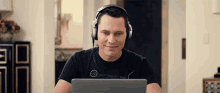 listening to music with headphones bobbing head bobbing working on computer laptop listening to music with headphones bobbing head bobbing working on computer laptop