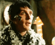 oswald chesterfield cobblepot covered in feathers penguin gotham robin taylor