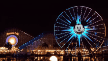 ferris wheel amusement ride amusement park lights mickey mouse