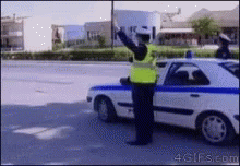 Cops High Five GIF - Cops High Five Traffic Enforcer - Discover &amp; Share GIFs