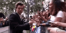 harry styles autograph signing dunkirk fans tongue out