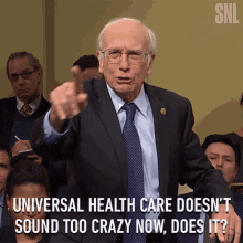 Universal Health Care Doesnt Sound Too Crazy Now Does It Larry David GIF - Universal Health Care Doesnt Sound Too Crazy Now Does It Larry David Saturday Night Live GIFs