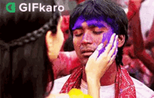 Wipe Paint On Your Face Gifkaro GIF - Wipe Paint On Your Face Gifkaro Lets Color Your Face GIFs