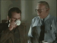 Inspector Drinking Coffee GIF - Inspector Drinking Coffee Derrick Stefan GIFs