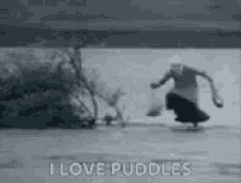 Man Jumping In Water Dancing In The Flood GIF - Man Jumping In Water Dancing In The Flood Grocerys In The Flood GIFs