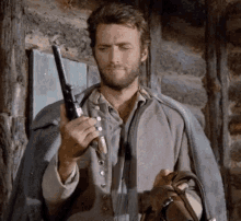 Clint Eastwood Keep Gun GIF - Clint Eastwood Keep Gun Gunsliging GIFs