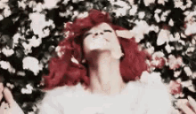 Rihanna Red Hair With Flowers GIF - Rihanna Flowers Redhair GIFs