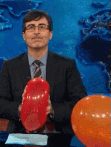 Pop GIF - The Daily Show John Oliver Balloons GIFs