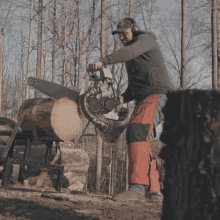 Sawing Through A Tree Trunk Red Bull GIF - Sawing Through A Tree Trunk Red Bull Sawing GIFs