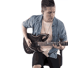 playing the guitar cole rolland strumming the guitar guitarist performing artist playing the guitar cole rolland strumming the guitar guitarist performing artist