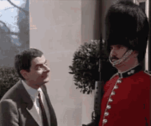 Messing With The Royal Guard - Mr. Bean GIF - Mr Bean Royal Guard Annoying GIFs