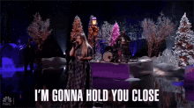 Im Gonna Hold You Close Kelly Clarkson GIF - Im Gonna Hold You Close Kelly Clarkson Rockefeller Christmas GIFs