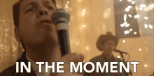 in the moment singing performing vocalist holding mic in the moment singing performing vocalist holding mic
