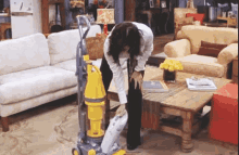 Monica Cleaning GIF - Monica Cleaning Vacuum GIFs