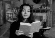 Reading Addams Family GIF - Reading Addams Family Morticia Addams GIFs
