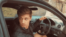 In The Car Looking Back GIF - In The Car Looking Back Turn Around GIFs